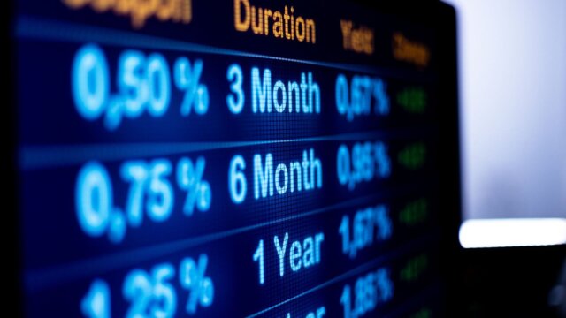 Close up computer monitor with yields and rates. financial business, mortgage rates, debt financing and banking industry.