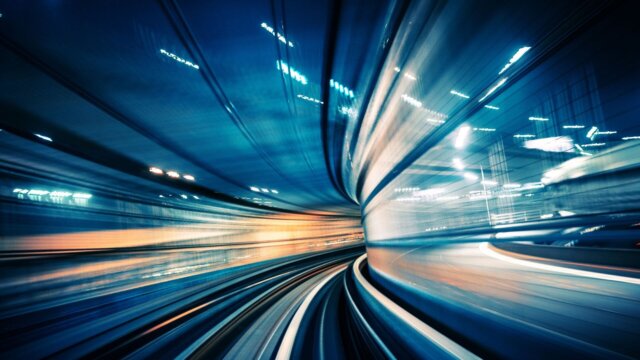 Motion-blurred view of moving train.