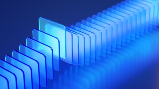 Row of blue panels with one rising about the others.