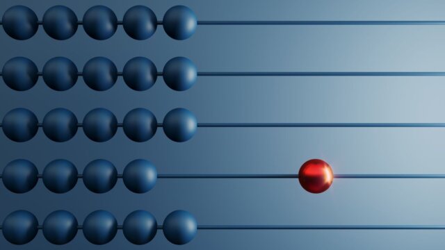 Different red colored around others on an abacus.